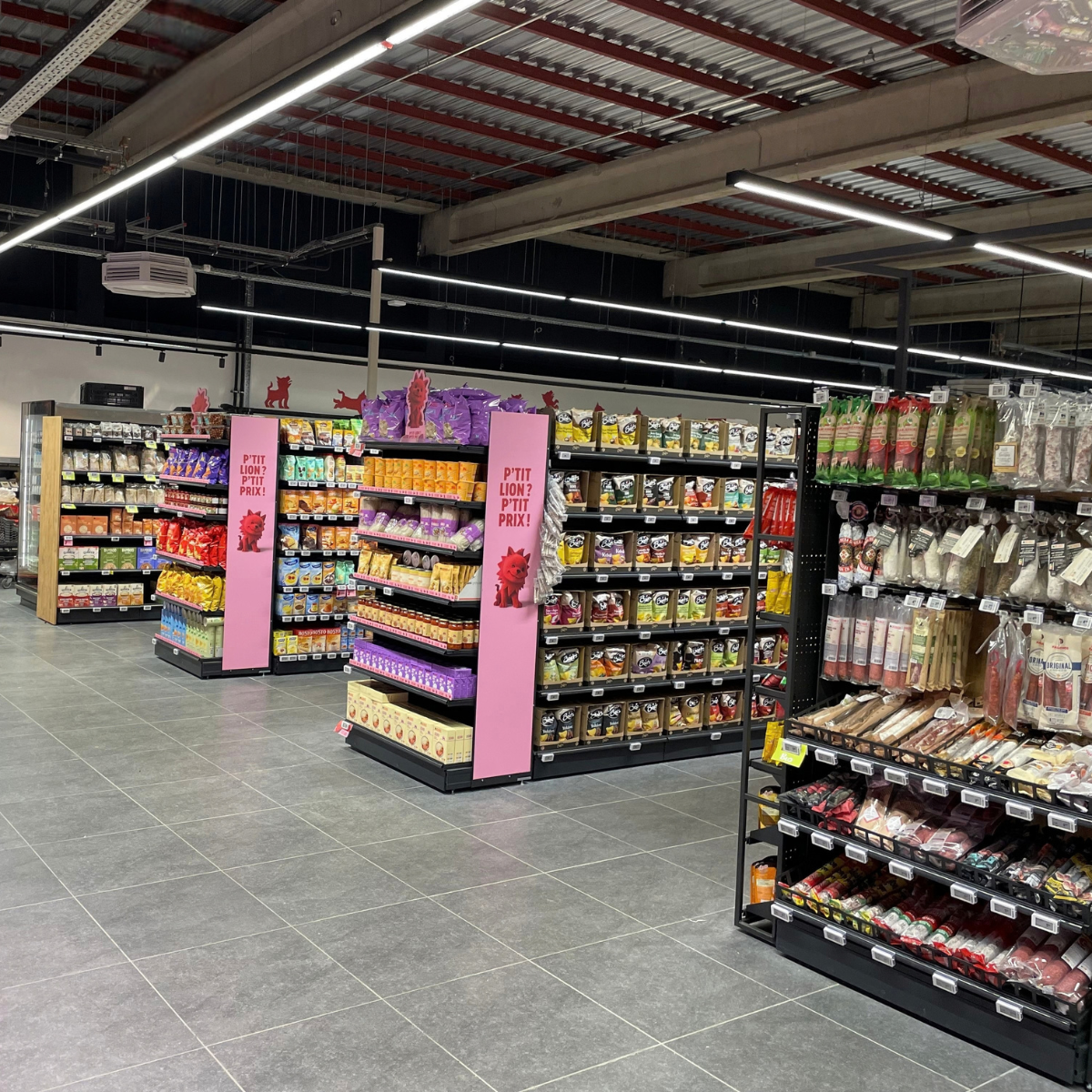 Éclairage des allées d’un magasin alimentaire à Amay